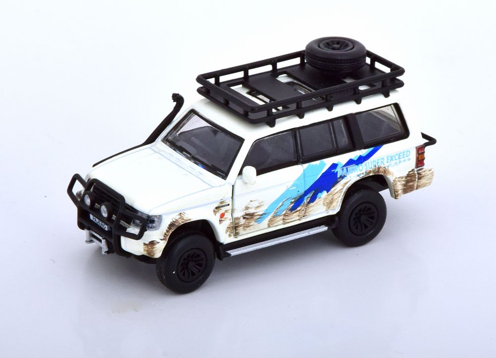 1:64 MITSUBISHI Pajero Jungle Pack (1996), white blue - 64B0054