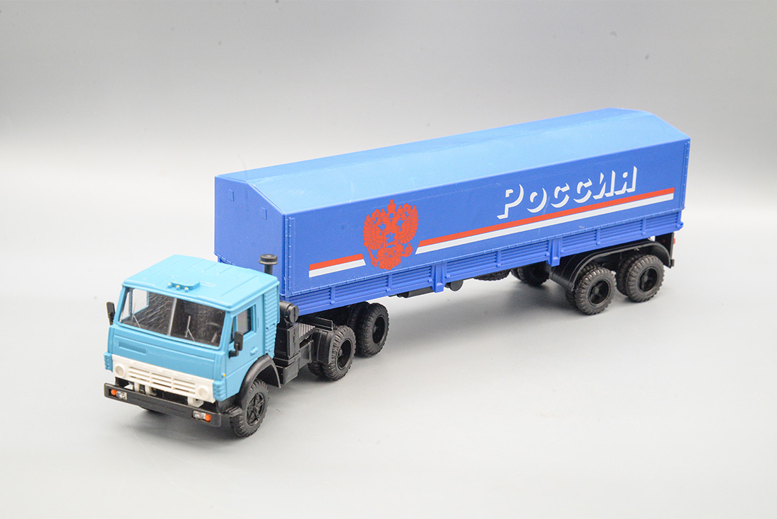 1:43 КАМАЗ 5410 с полуприцепом ОДАЗ-9370 с тентом 'Россия' (тент, платформа синие, рама черная, герб красный), синий/голубой - ELK-1131