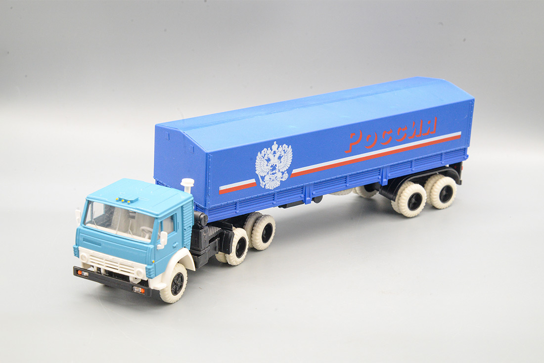 1:43 КАМАЗ 5410 с полуприцепом ОДАЗ-9370 с тентом 'Россия' (рама черная, салон, покрышки, зеркала белые), синий/голубой/белый - ELK-1130