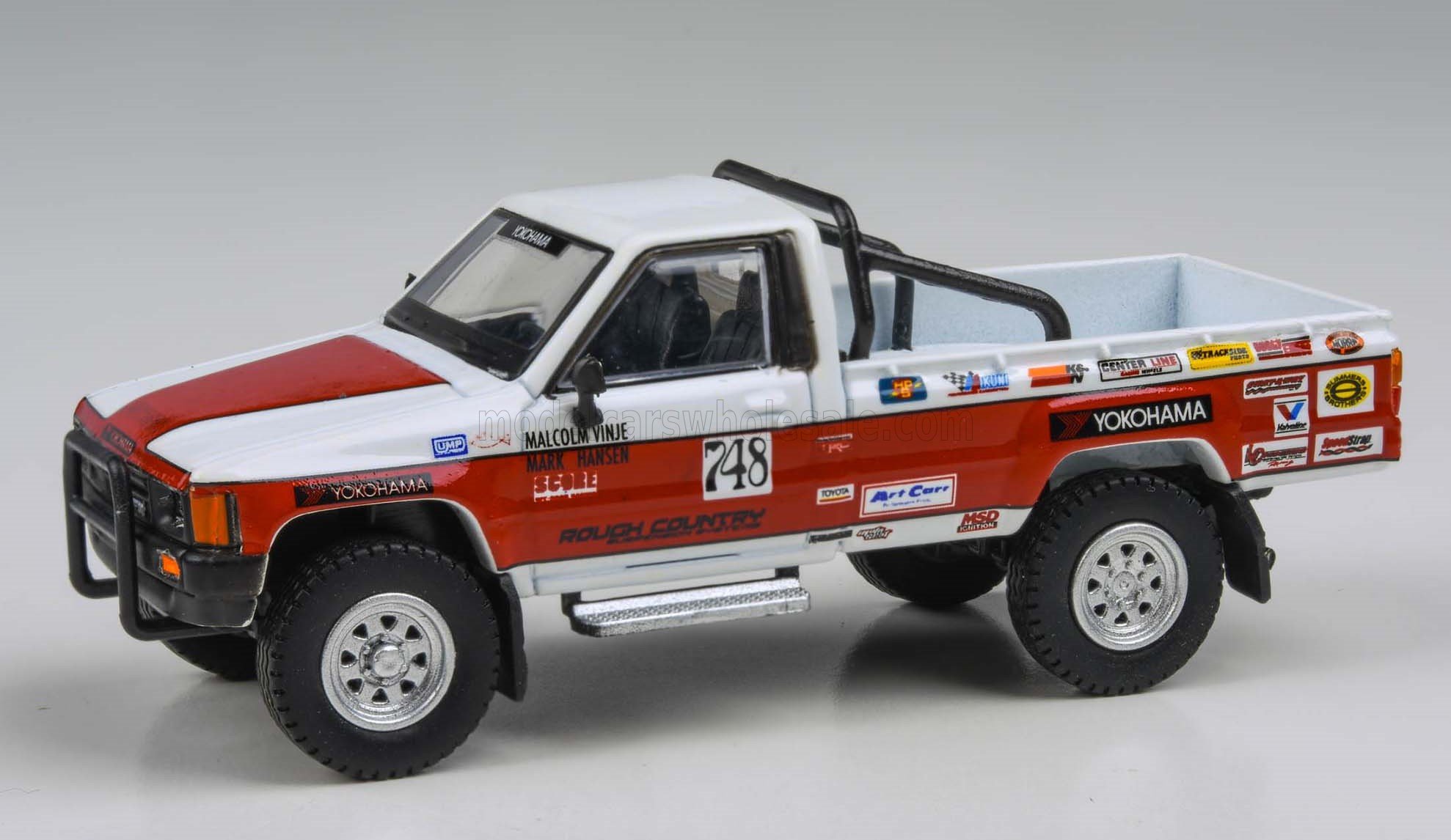 1:64 TOYOTA Hilux Pick-up Racing Lhd (1985), White Red - PA-55527