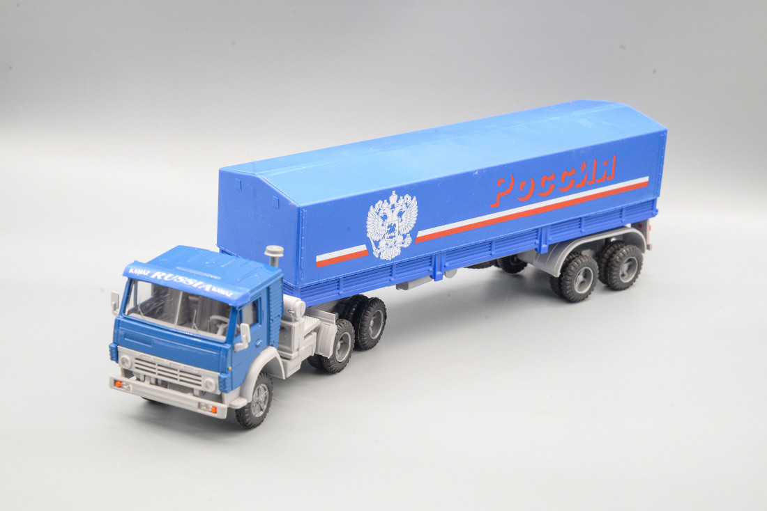 1:43 КАМАЗ 5410 (синий визор с надписью Россия) с полуприцепом ОДАЗ-9370 с тентом 'Россия', синий/белый - ELK-1129