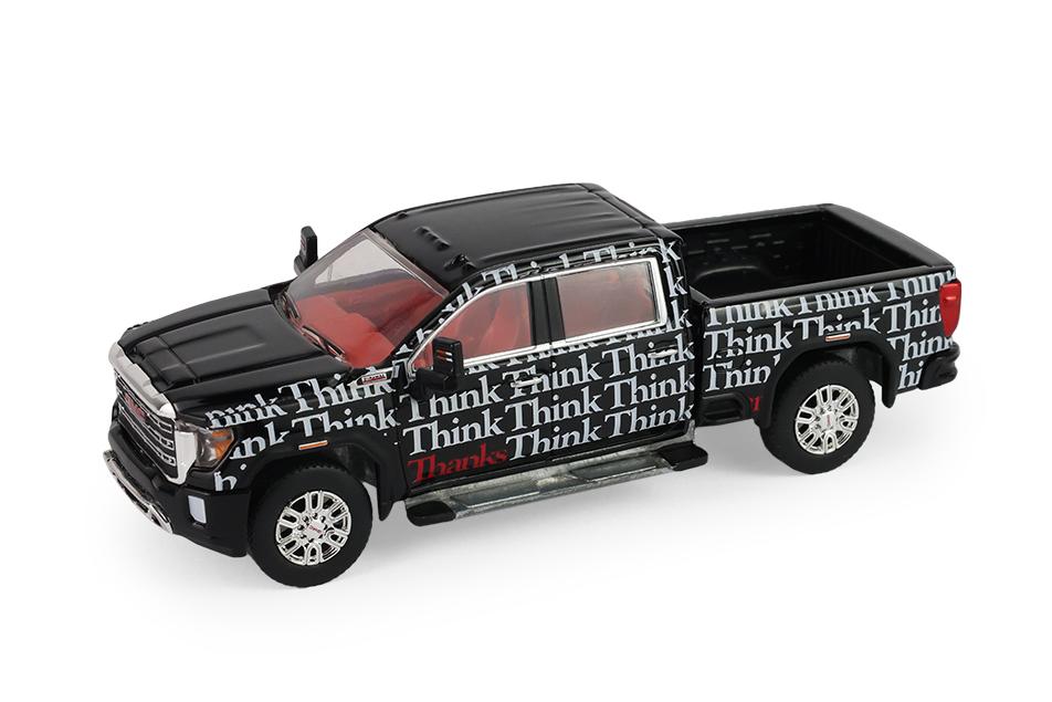 1:64 GMC Sierra 2500 HD SLE, Think, Think, Thanks *Smokey Bear Series 5* (2023), black / white - 38090F