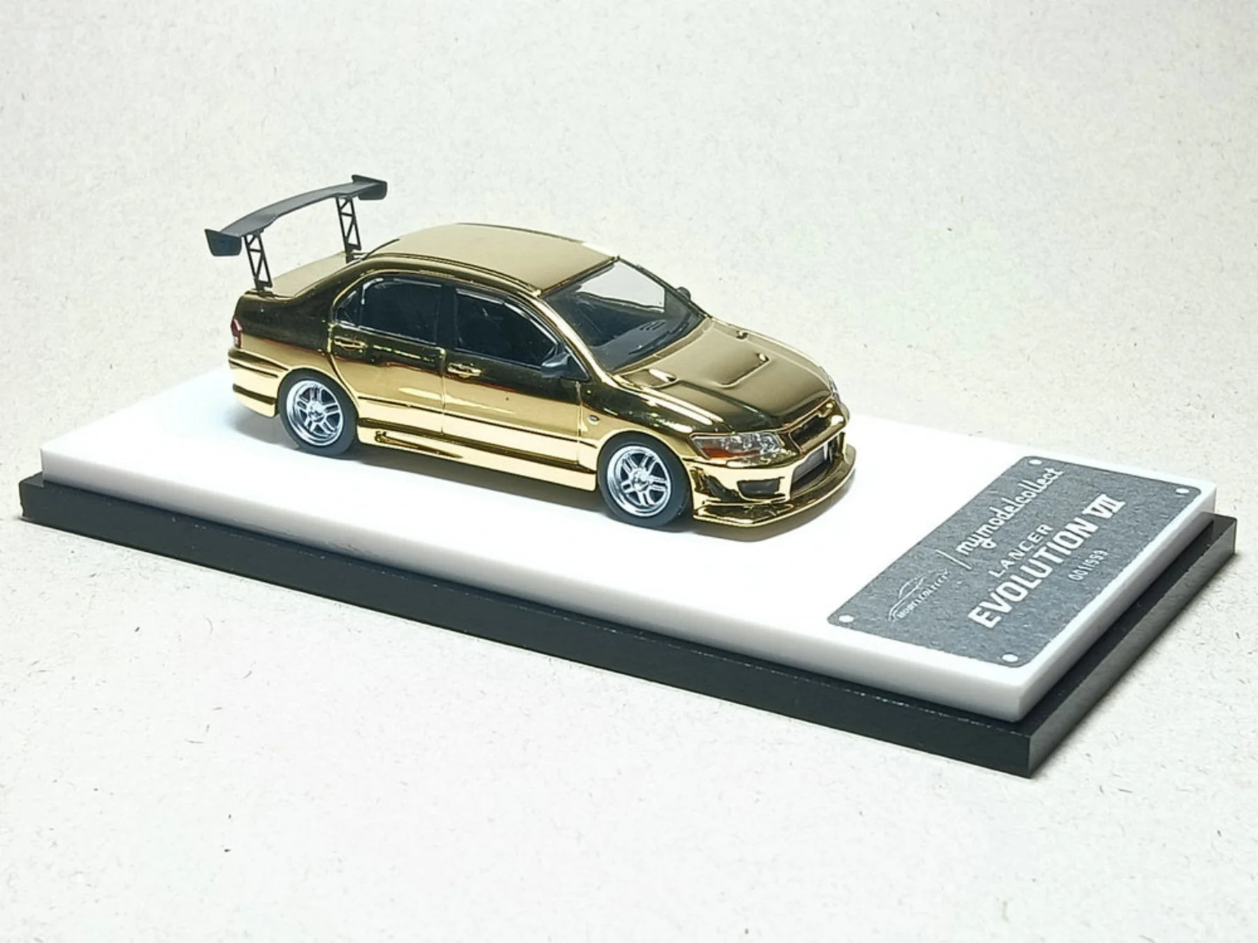 1:64 MITSUBISHI Evolution EVO VII, chrome gold - C640015B